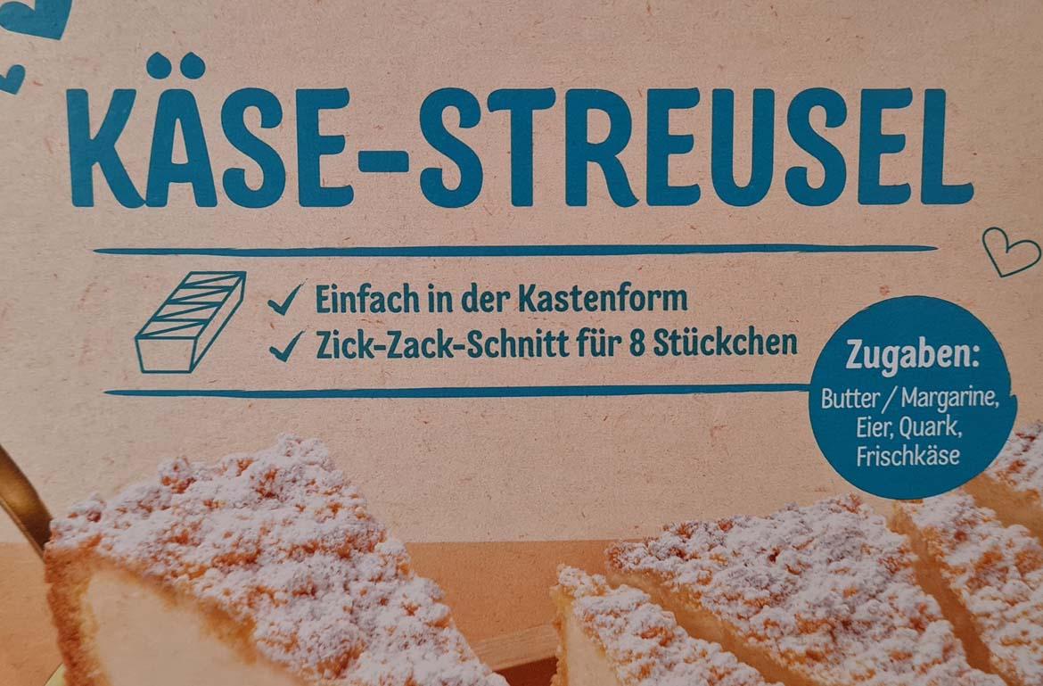 Mogelpackung: Dr. Oetker Käse-Streusel Backmischung (2025) Kastenform mit Zick-Zack-Schnitt