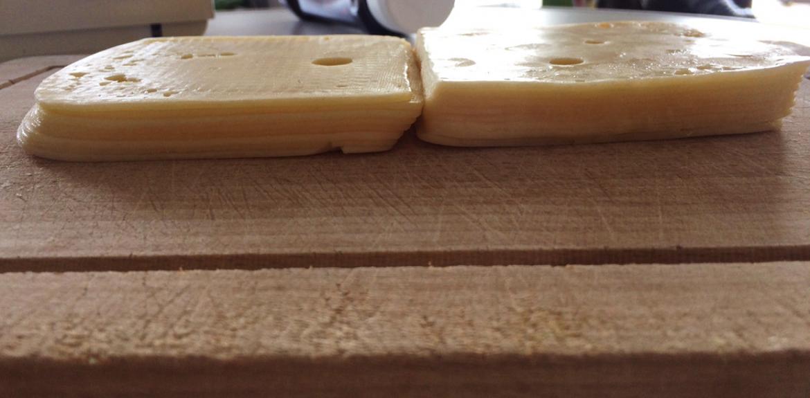 Vergleich des Packungsinhaltes der neuen und der alten Packung Grünländer Käse